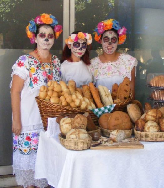 selling bread in full makeup in Santa Lucia Park