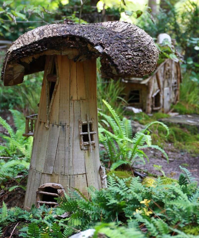 disguised to look like a mushroom this little fairy house is tucked into a fairy garden in Ireland