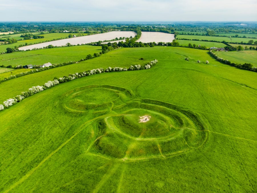 the Hill of Tara in Ireland a drone view of the area. Circular mounds in the green grass can be seen from the air -  Travelling in Ireland without a car 