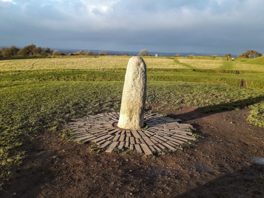 the Stone of Destiny  sits on the Hill of Tara Ireland, a simple rounded stone monument 