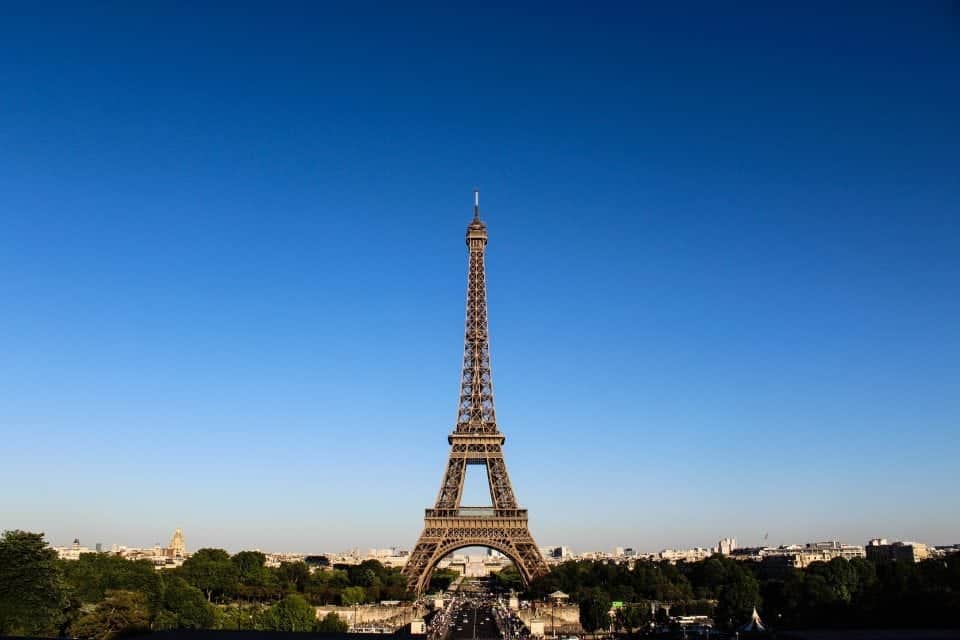 Travelling to France, blue sky with the Eiffel tower set against the backdrop of the sky.
