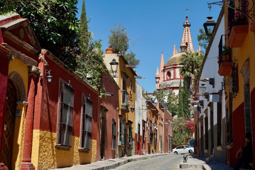 a row of houses on a narrow street in Mexico