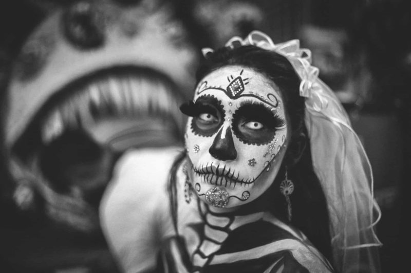 face painted to look like a calavera in Mexico