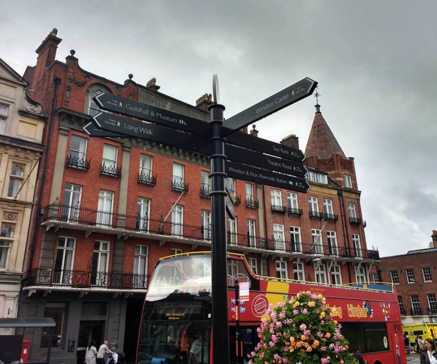 sign posts in Windsor and a hop on hop off bus