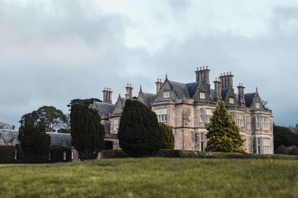 muckross house killarney an old stone mansion with fancy chimneys and mullioned windows