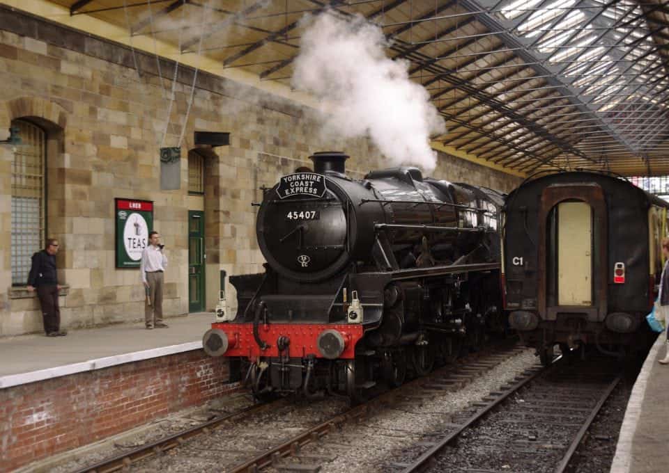Pickering railway station with a steam train pulling into the station