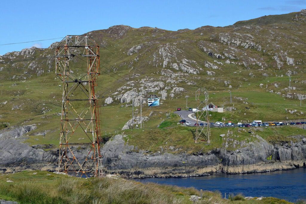 Dursey Island Cable Car passes over a small bay to hills covered in rocks and stones