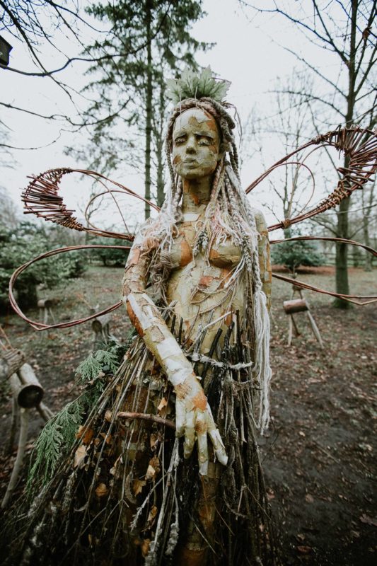 a guide to finding Irish fairies a fairy sculpture made from twigs and wood