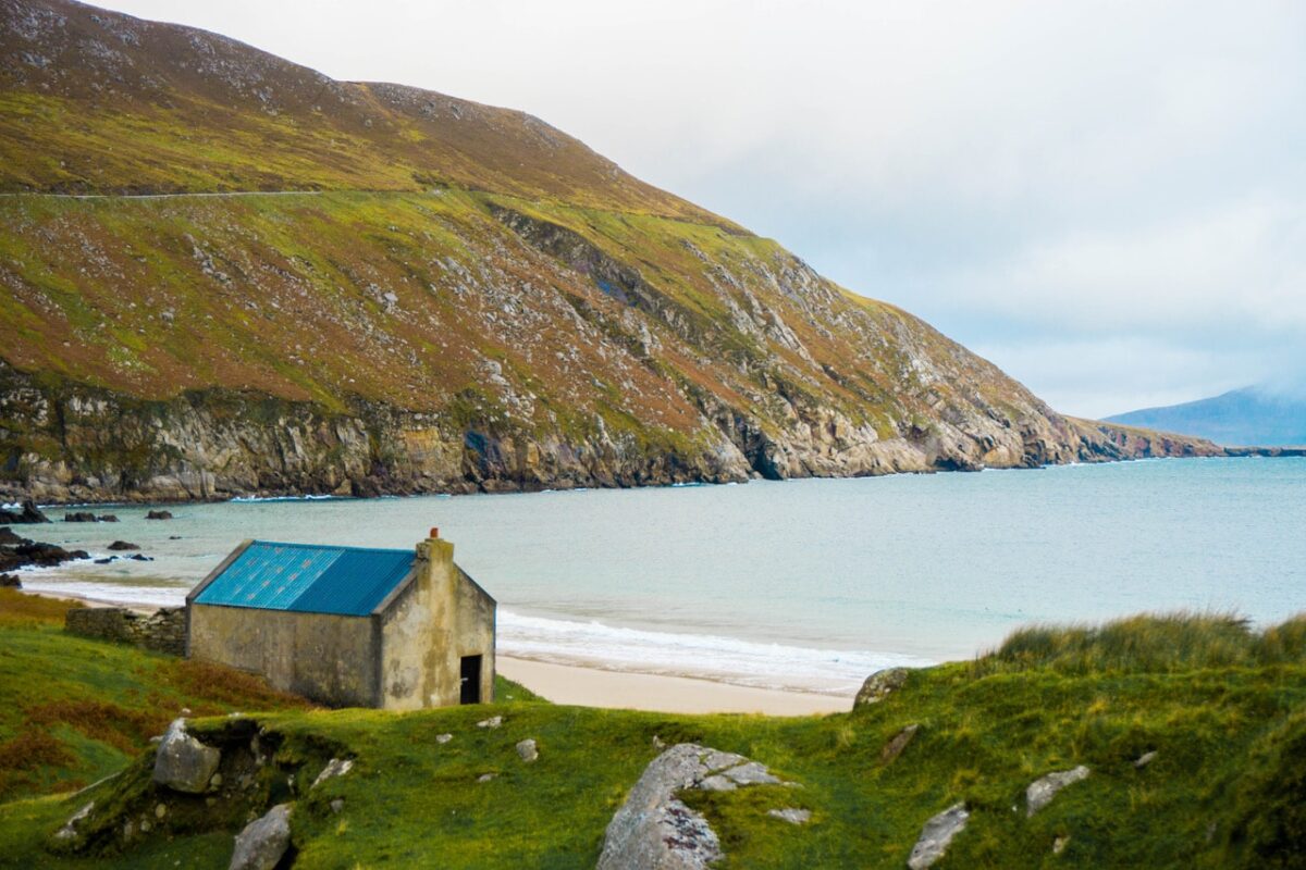 Landmarks of Ireland, a view of the bay, cliffs and an Irish cottage on Achill Island Ireland