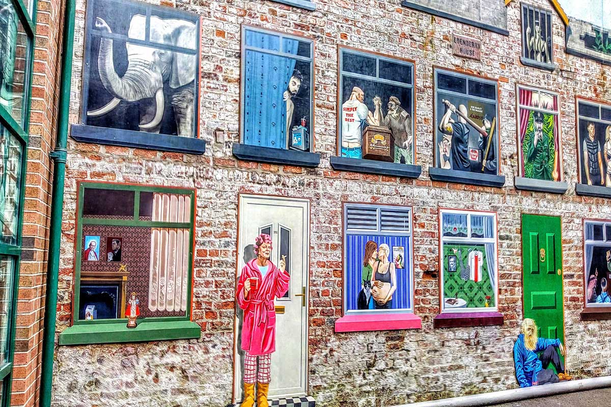 Cathedral District in Belfast with murals covering the walls