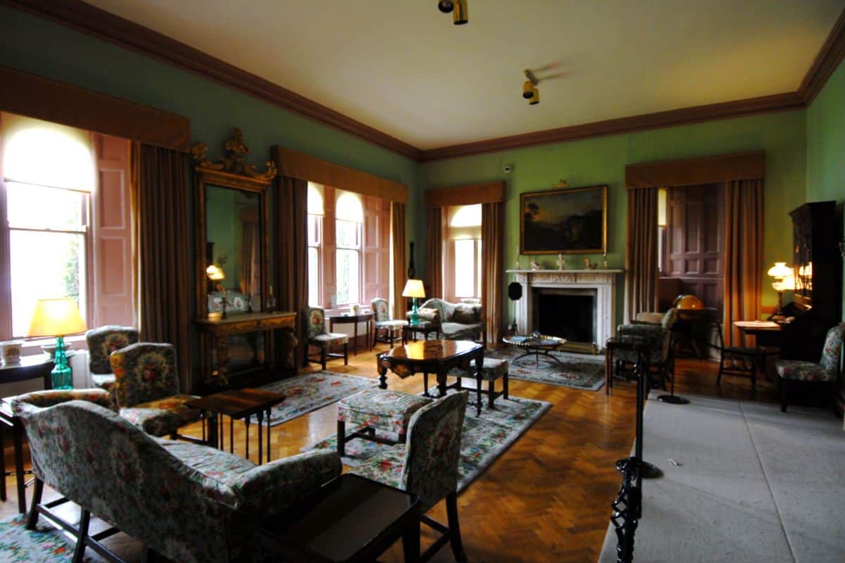 the formal drawing room at Glenveagh Castle deep shades of emerald green