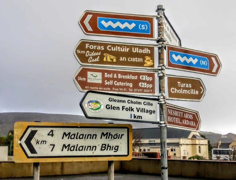 a signpost full of signs for the Wild Atlantic Way, Glencolmcille, and other ares you must see in Donegal