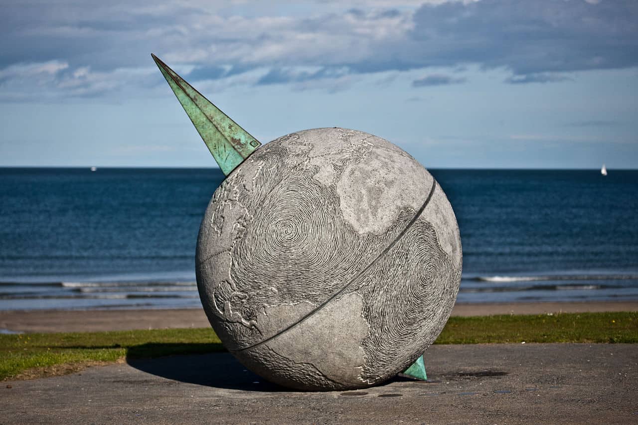 one of Ireland's best beaches Portmarnock outside Dublin a sculpture of the globe that sits on the beach