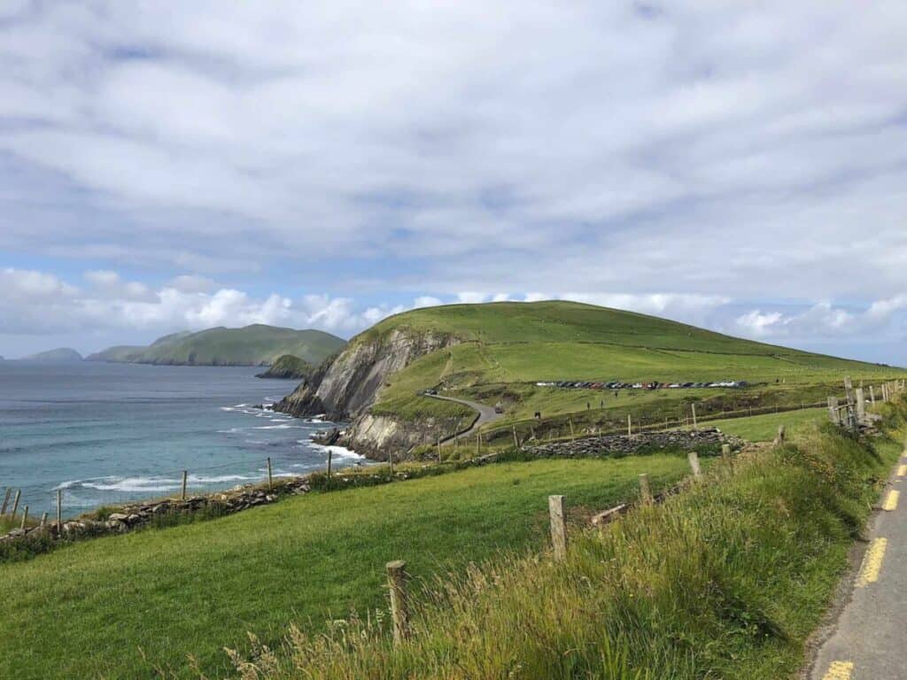 the famous Dingle peninsula, green rows stretching for miles with a narrow strip of a road