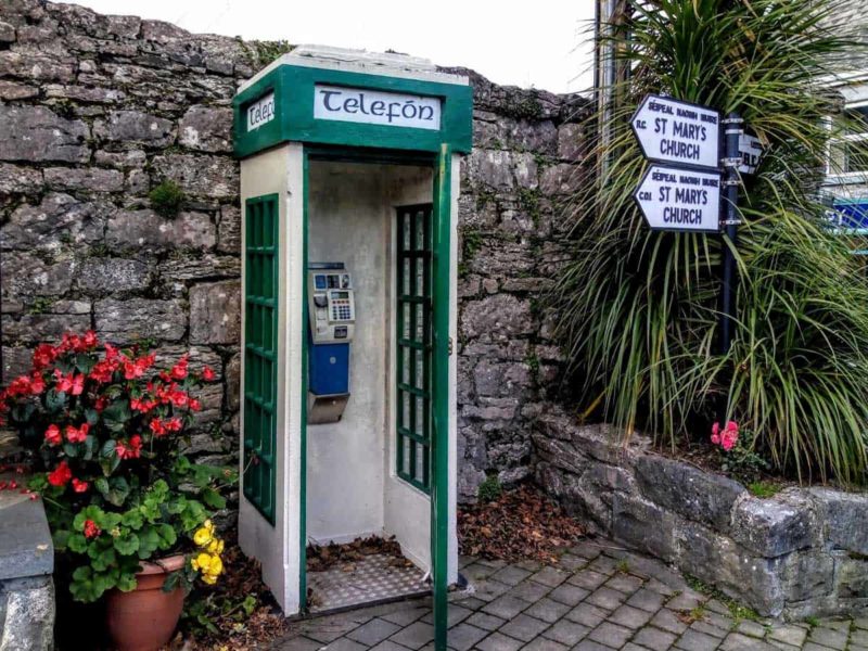 Irish telephone box with flowers in Cong, Ireland