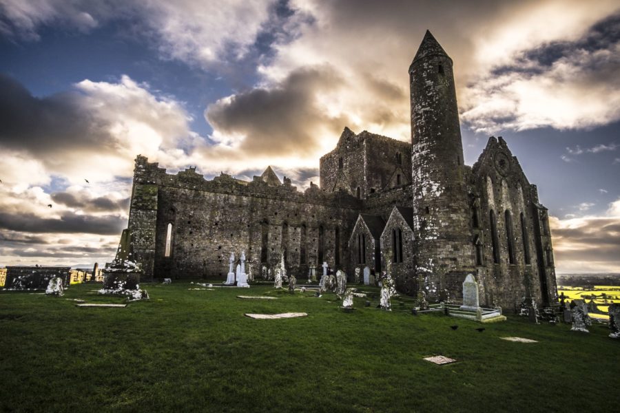 Cross on Rock of Cashel with cloudy background in Ireland