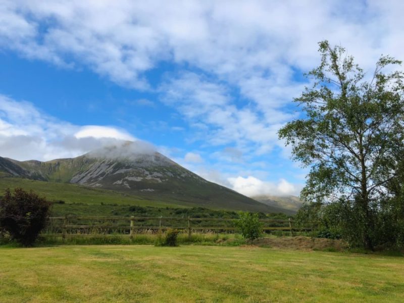 Croagh Patrick mountain in Co. Mayo, Westport, West coast of Ireland, Atlantic ocean. Buying a plot of land in Ireland