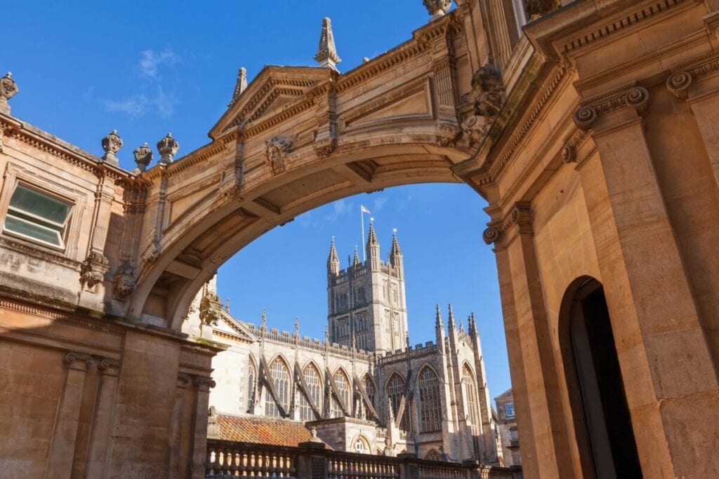 Bath Abbey, Bath, UK viewed through the ornate arch on York Street.