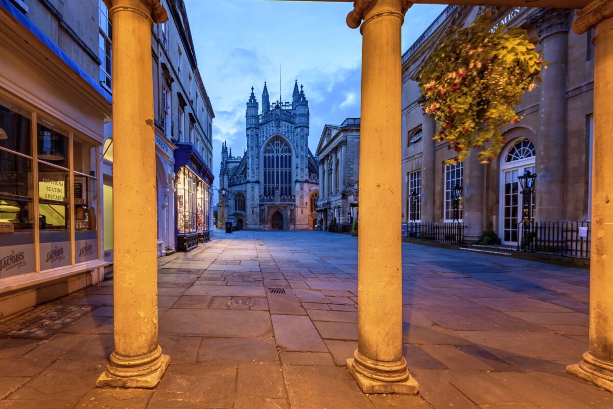 Bath Abbey viewed through the roman pillars, Bath city, UK.