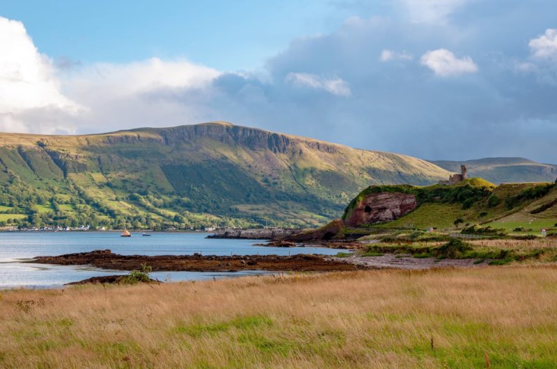 Western coast of County Antrim, Northern Ireland, UK, with the ruin of medieval Red Bay Castle, cliffs near Glenariff, Watrerfoot and Cushendall at coast road A2, a.k.a Causeway Coastal Route