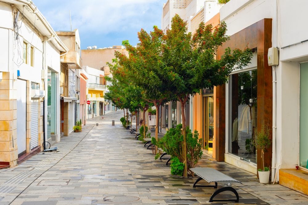 shopping street in central touristic district of Paphos with green trees, Cyprus