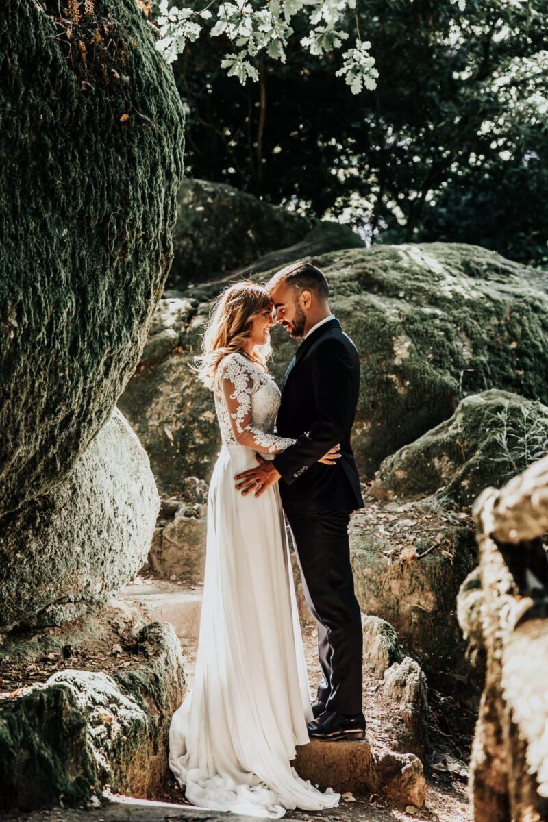 married couple photo on the boulders and stones of the lake