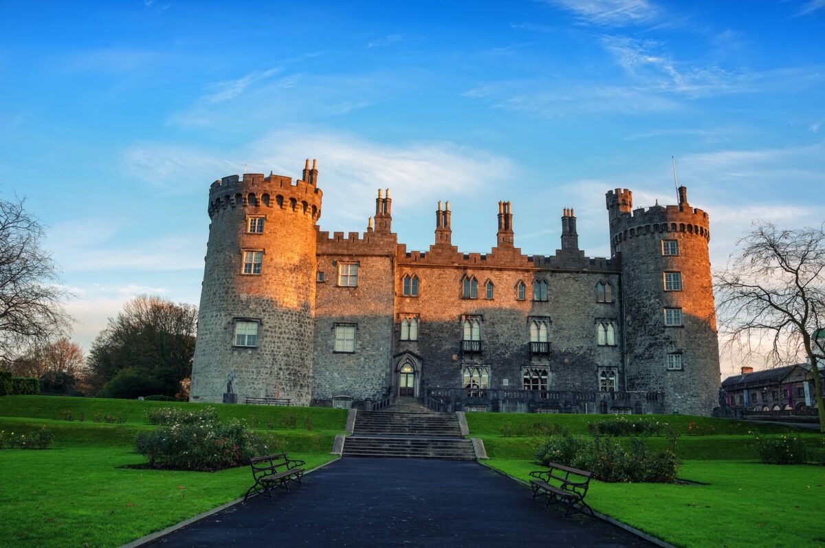 Kilkenny Castle and gardens in the evening. It is one of the most visited tourist sites in Ireland