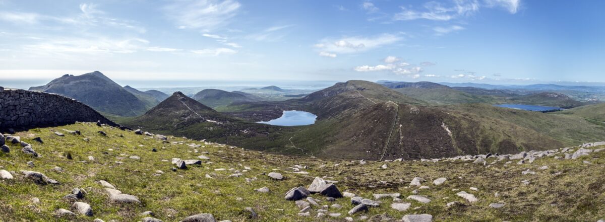 a panorama taken of the mourne mountains includes slieve binnian and doan mountain also fofanny reservoir