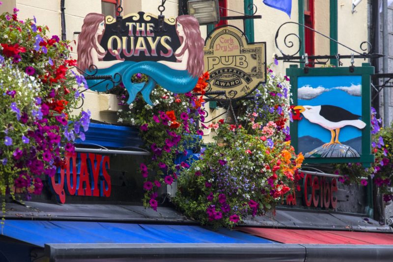 Galway, Republic of Ireland - August 19th 2018: The signs of numerous pubs and bars on Quay Street in the city of Galway, Republic of Ireland.