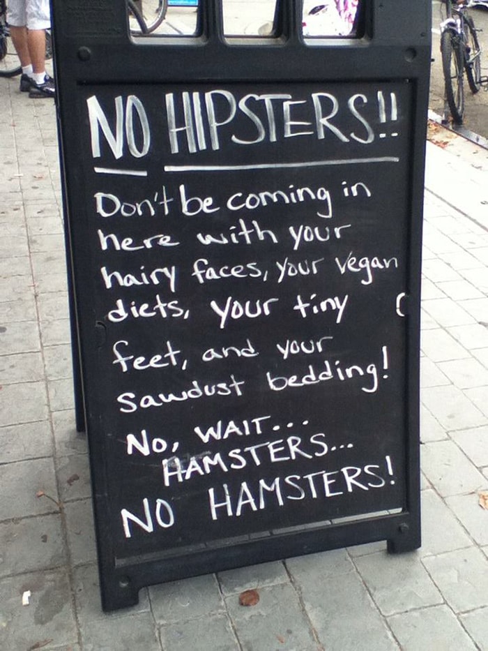 A sign that says no hipsters, featuring Irish Slang.