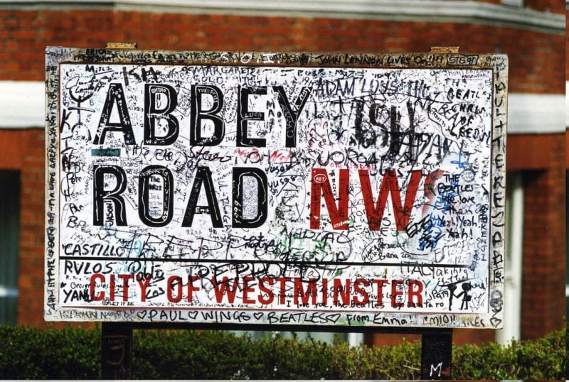 graffitti covered Abbey Road street sign