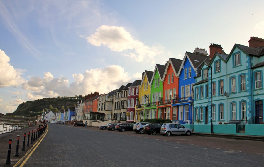 Small village on Antrim coast with coloured houses, Northern Ireland, United Kingdom