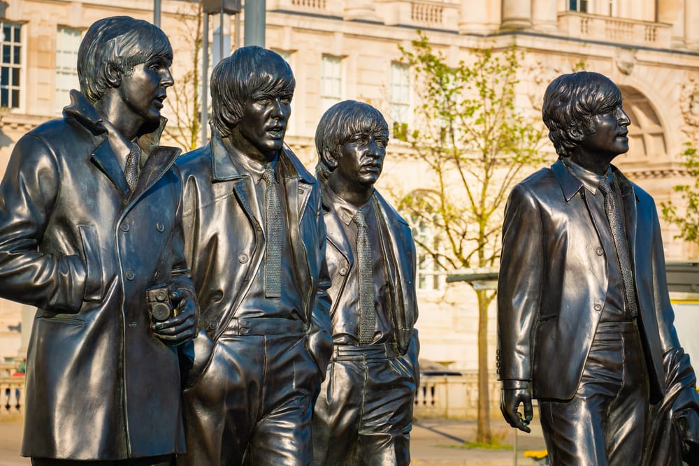 Bronze statue of the  Beatles stands at the Pier Head on the side of River Mersey, sculpted by Andrew Edwards and erected in December 2015