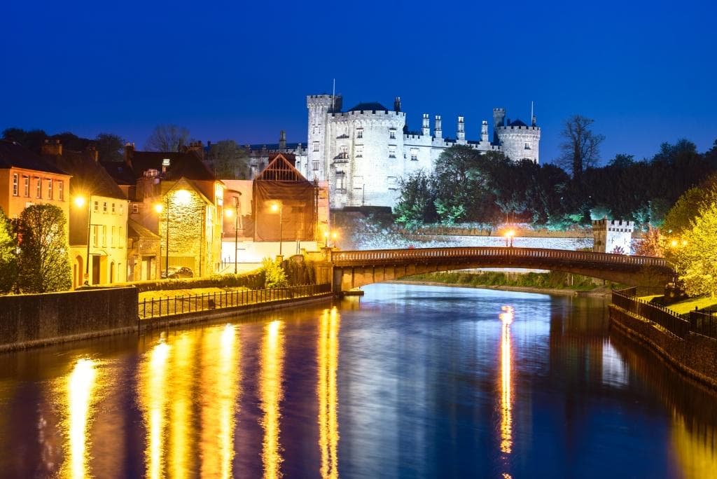 Kilkenny Castle seen above the River Nore as it flows through Ireland