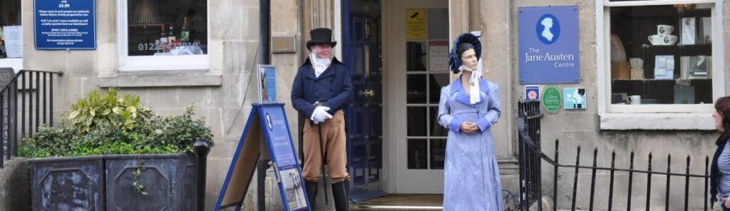 The Jane Austen centre in Bath England, Two Regency costumed docents stand outside this gorgeous Georgian building