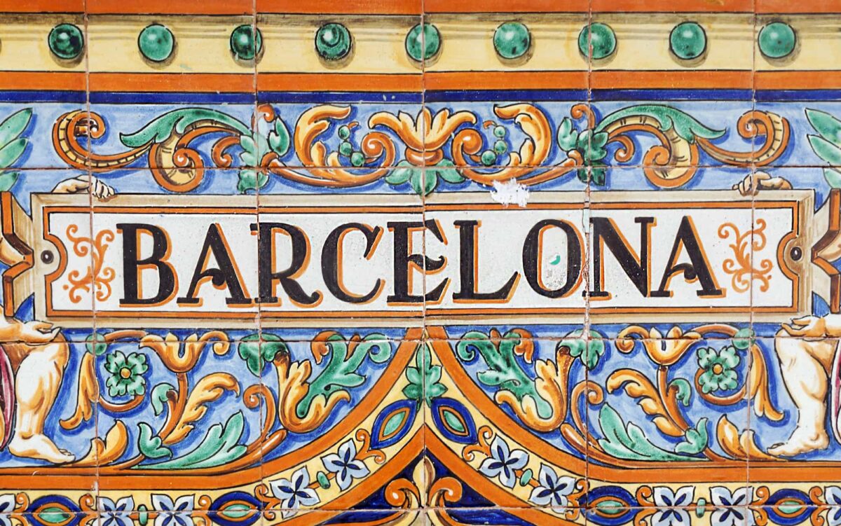 A tile placque spelling out Barcelona in bright colours one day in Barcelona