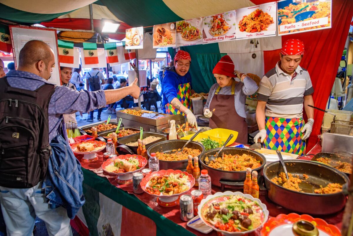 Food stalls in Brick Lane Sunday Market in London, United Kingdom