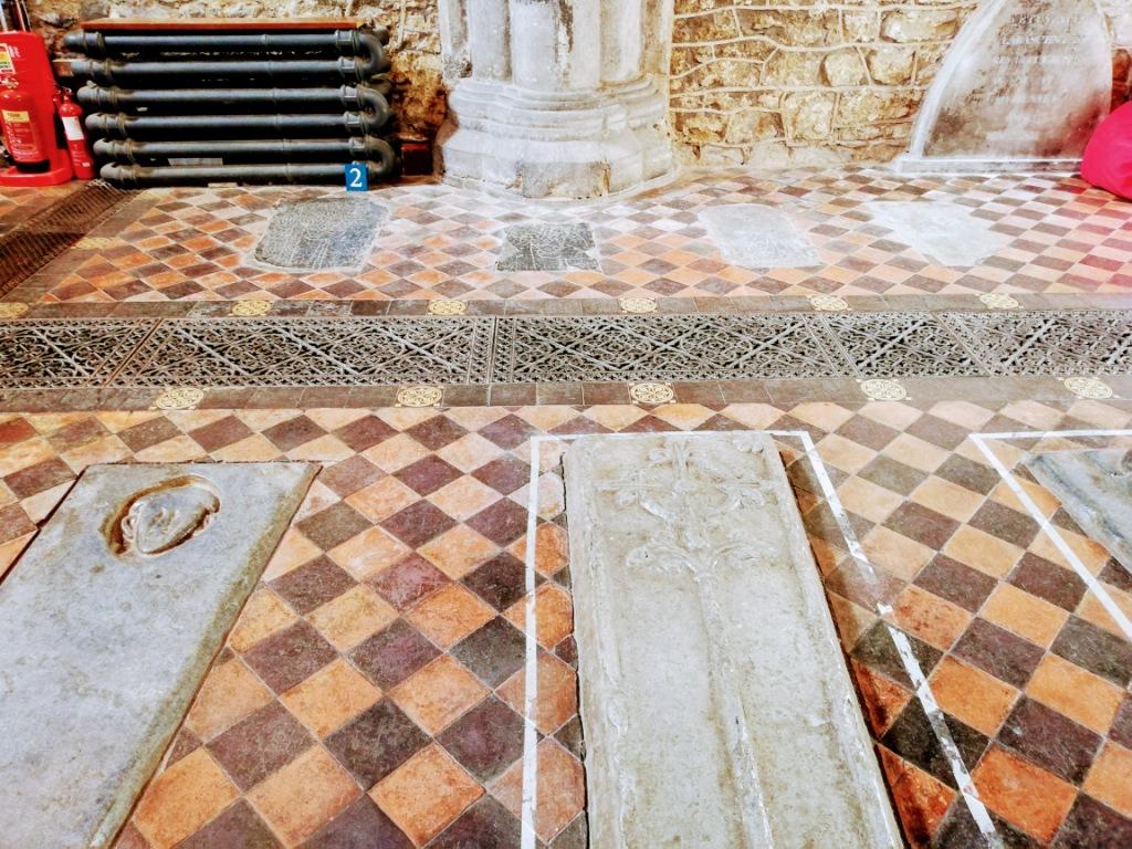ancient tombs laying underneath a floor slab in Kilkenny