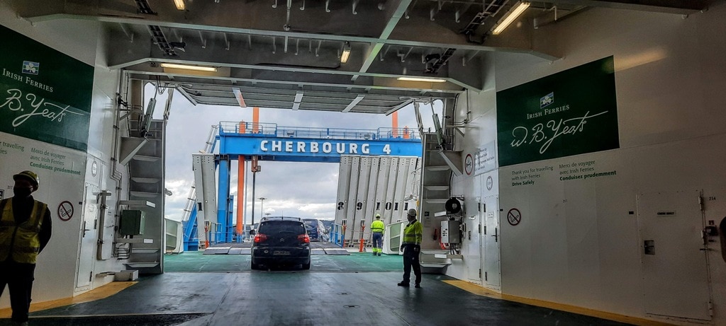 Travelling to France the ferry from Dublin to Cherbourg, cars getting off the ferry once in port.