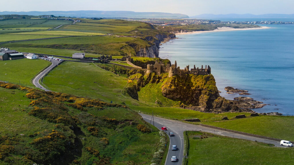 Aerial view over famous Dunluce Castle in North Ireland - travel photography