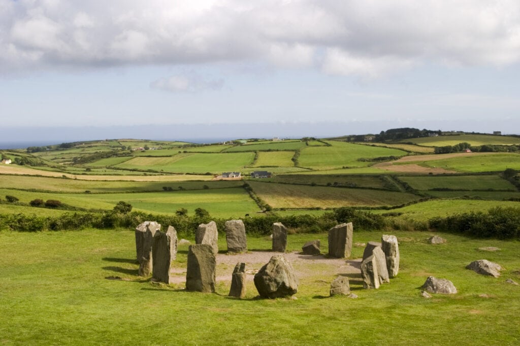 An ancient stone circle at Dombeg in County Cork in the southern part of Ireland. Stone circles were characteristic of the Bronze Age Celtic culture. Stone circles were often used for astronomical purposes although some believe that they might have been burial tombs.