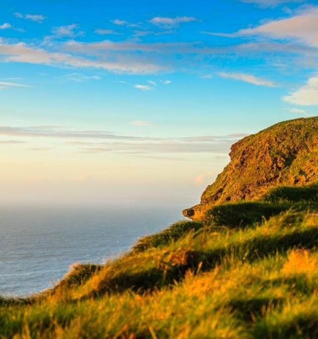 Cliffs of Moher - O Briens Tower castle at sunset  in Co. Clare Ireland Europe.