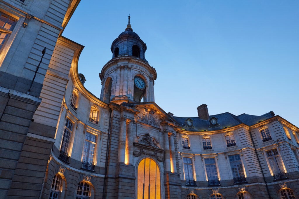 Rennes City Hall at dusk. The square city hall of Rennes, Brittany-France, on the old town square.