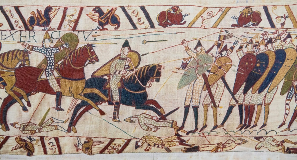 BAYEUX, FRANCE - FEB 12: Detail of the Bayeux Tapestry depicting the Norman invasion of England in the 11th Century on February 12, 2013. This tapestry is more than 900 years old, no property release is required.