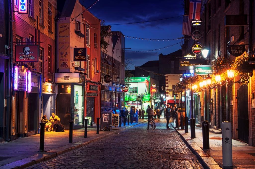 DUBLIN, IRELAND - SEPTEMBER 7, 2014: Nightlife at popular historical part of the city - Temple Bar quarter. The area is the location of many bars, pubs and restaurants