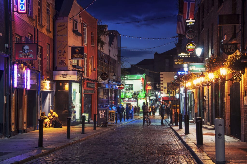 DUBLIN, IRELAND - SEPTEMBER 7, 2014: Nightlife at popular historical part of the city - Temple Bar quarter. The area is the location of many bars, pubs and restaurants