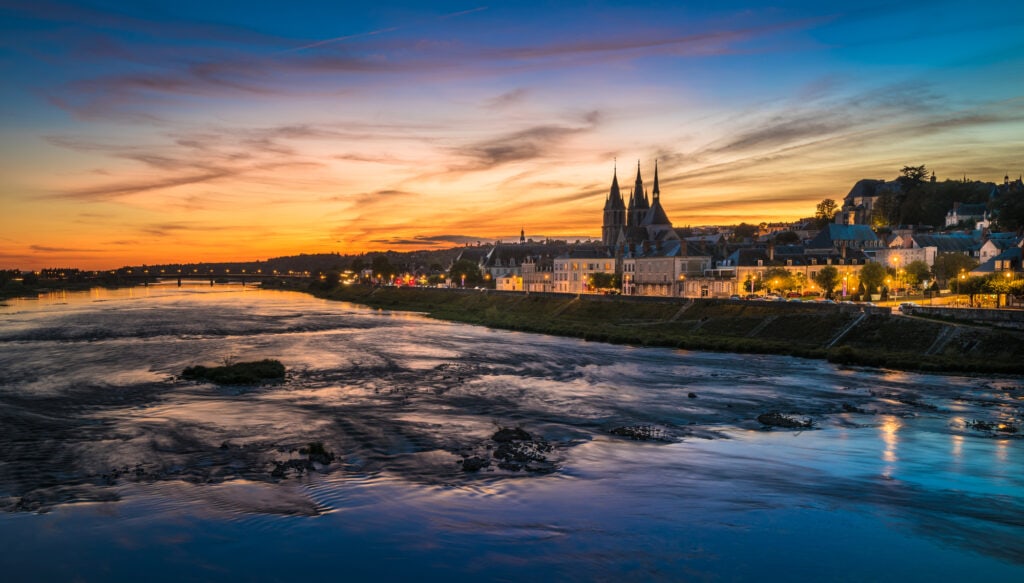 A view of Amboise France from the Loire River at sunset