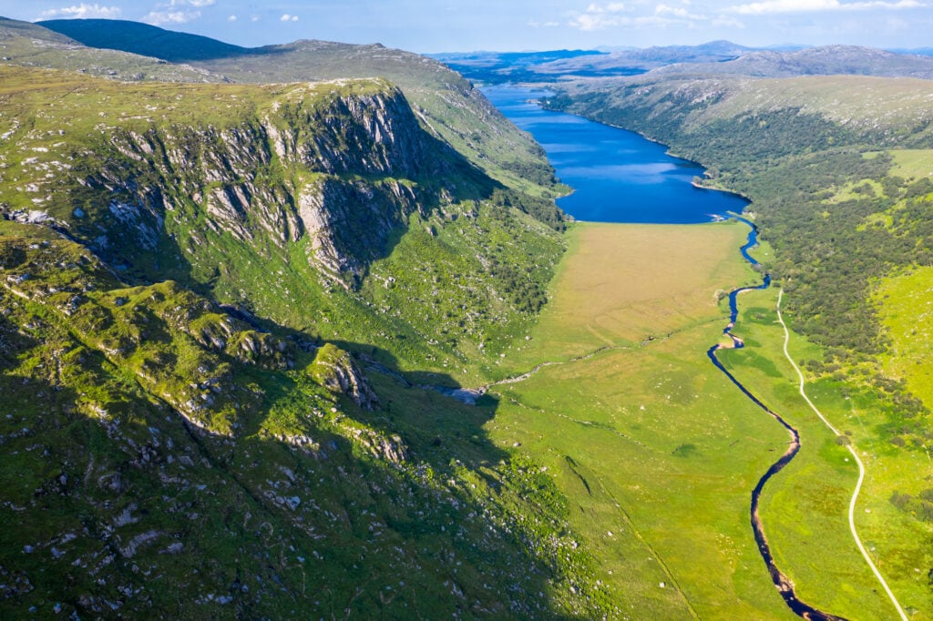 Aerial view of the Glenveagh National Park with castle Castle and Loch in the background - County Donegal, Ireland.