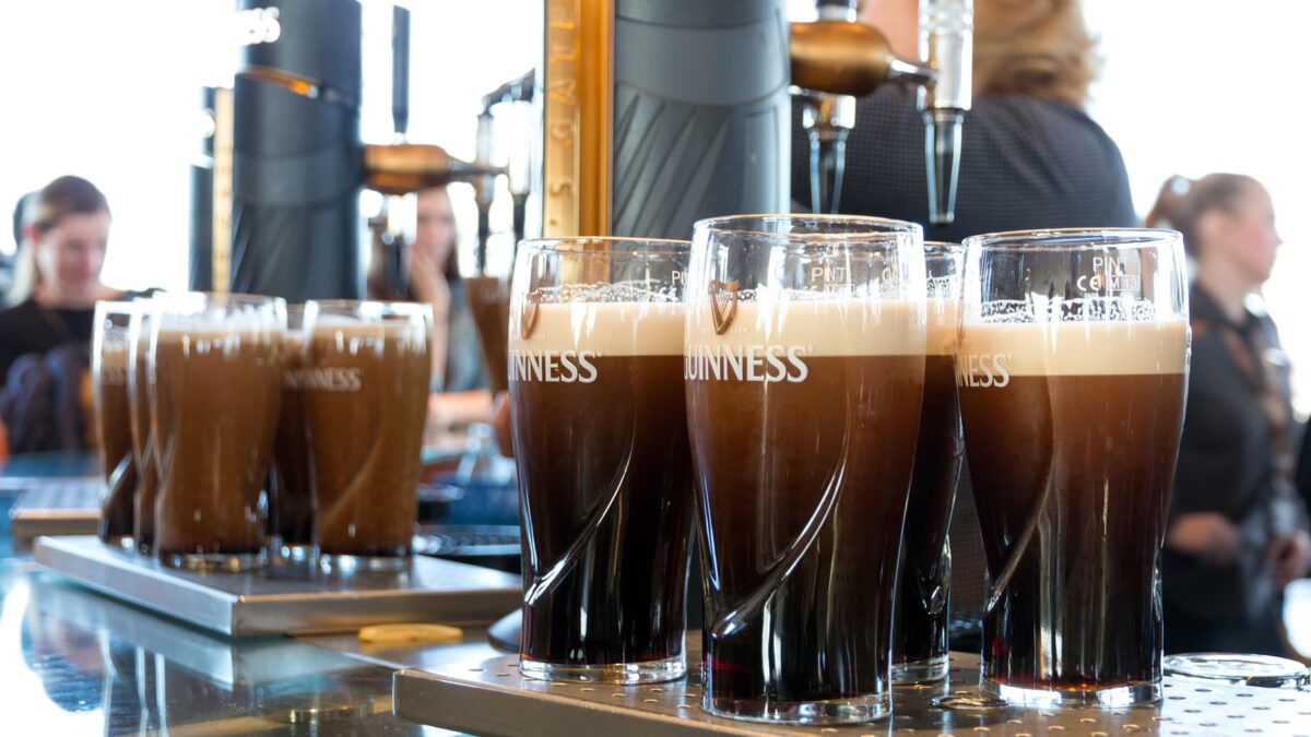 DUBLIN, IRELAND - FEB 15, 2014: Pints of beer are served at the Guinness Brewery on Feb 15, 2014. The brewery where 2.5 million pints of stout are brewed daily was founded by Arthur Guinness in 1759.