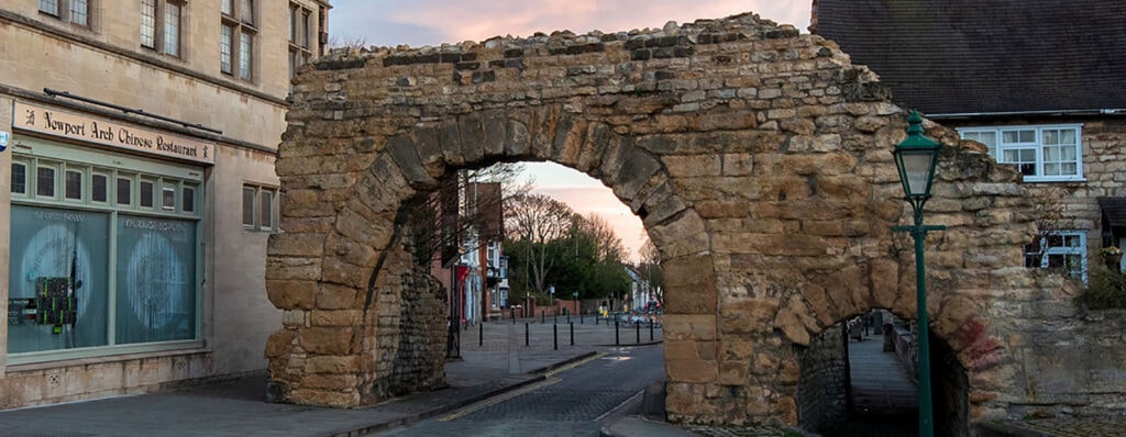 Newport Arch in Lincoln, the only Roman archway in the UK that still has traffic passing through it. You can see the arch and the ancient stones that built this remainder of Roman times in England.